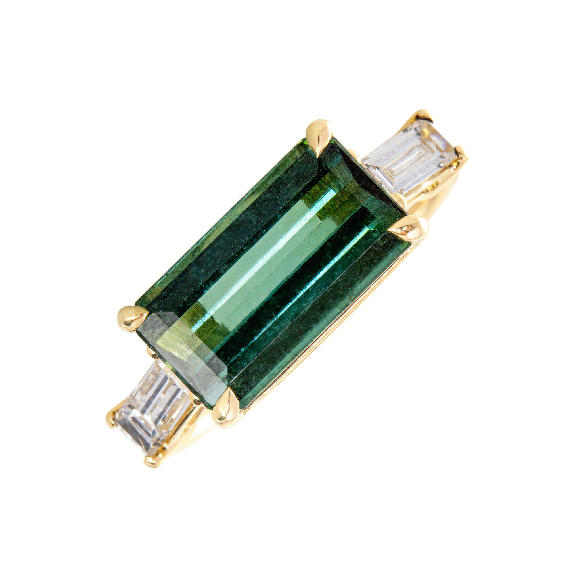 Trilogía oro amarillo 18kt, Turmalina verde talla octogonal,  Diamante talla baguette.