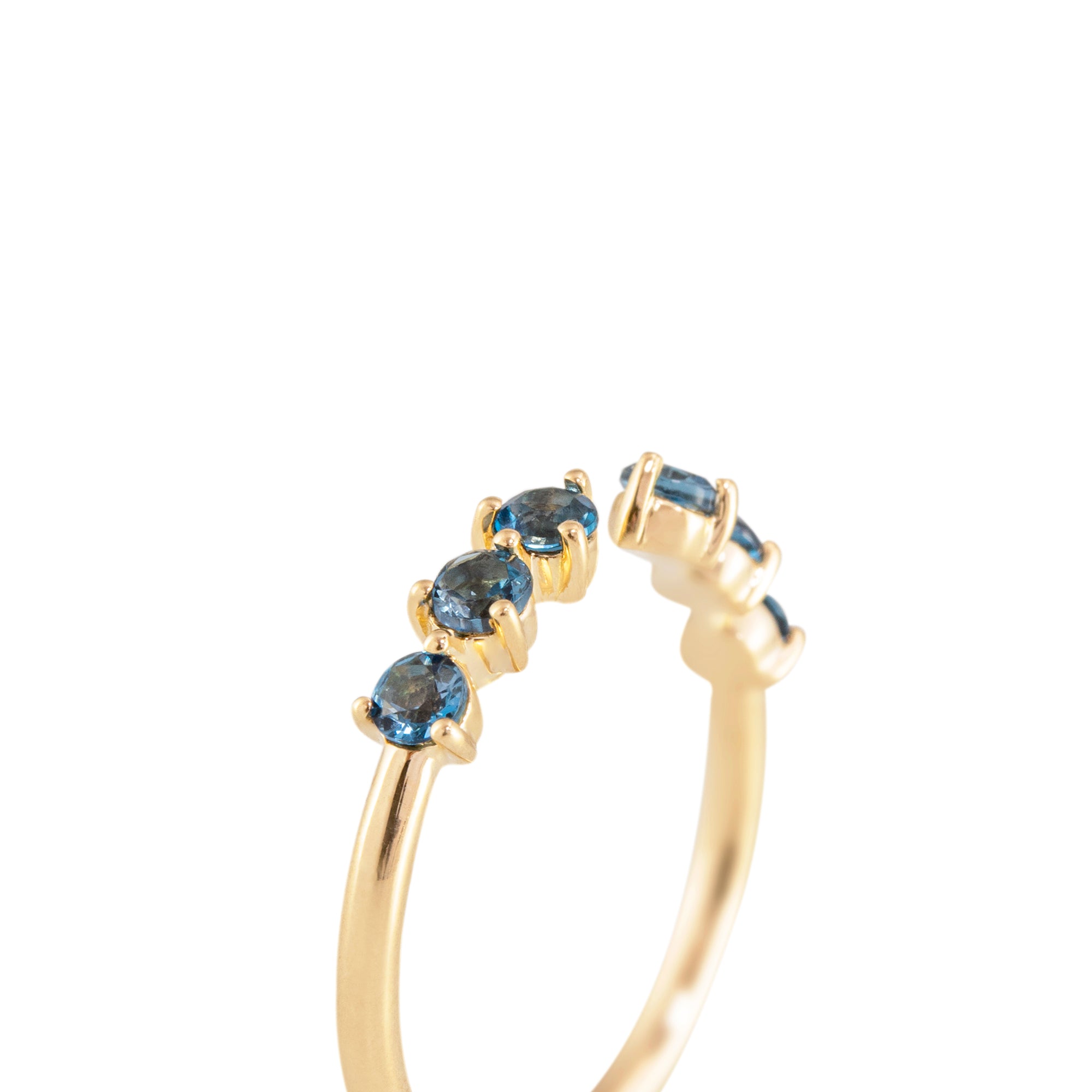 Anillo abierto en oro 18k con topacios en azul