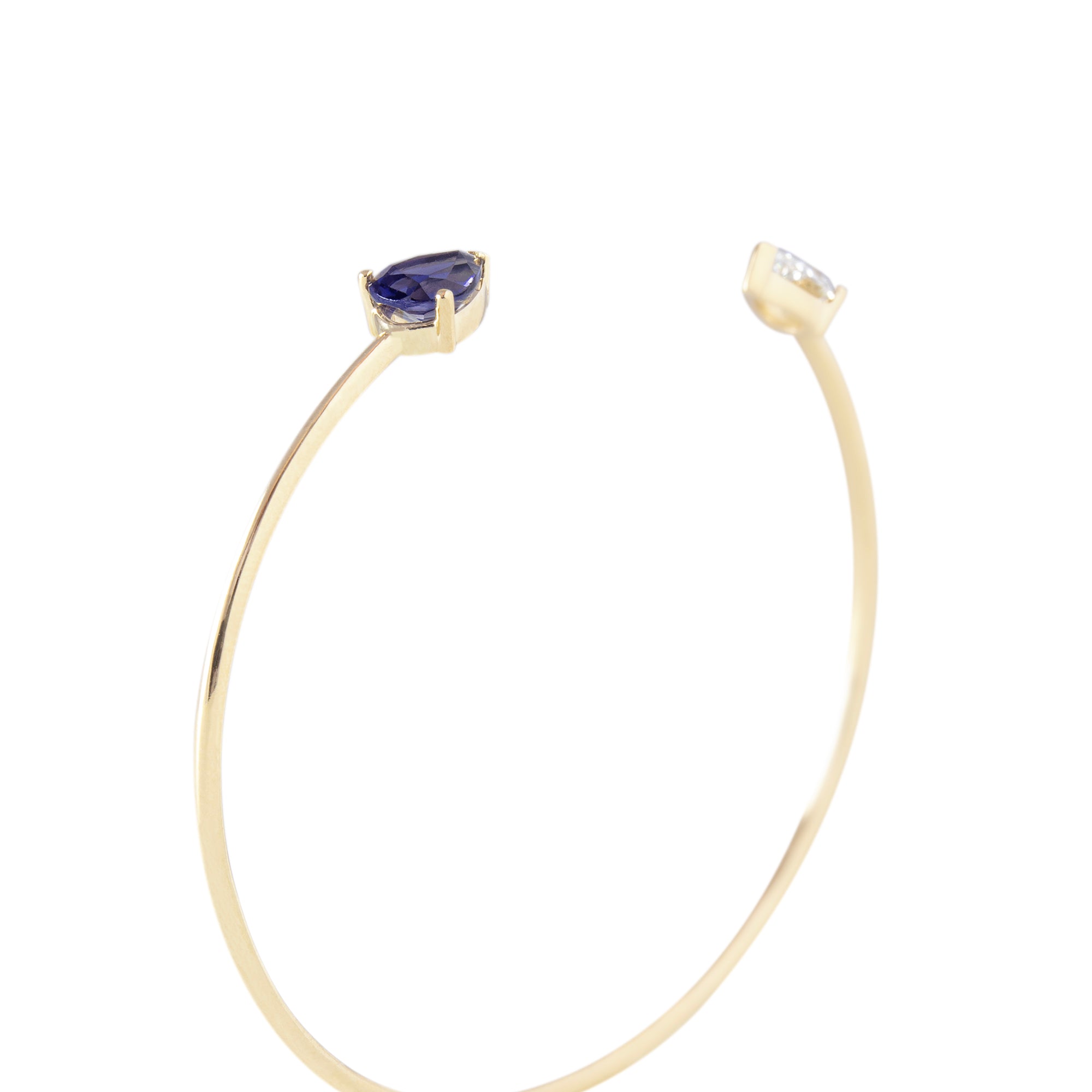 Esclava oro amarillo 18kt, Iolita talla pera, Topacio Blanca talla pera, Montura 3 grapas para realzar la piedra.