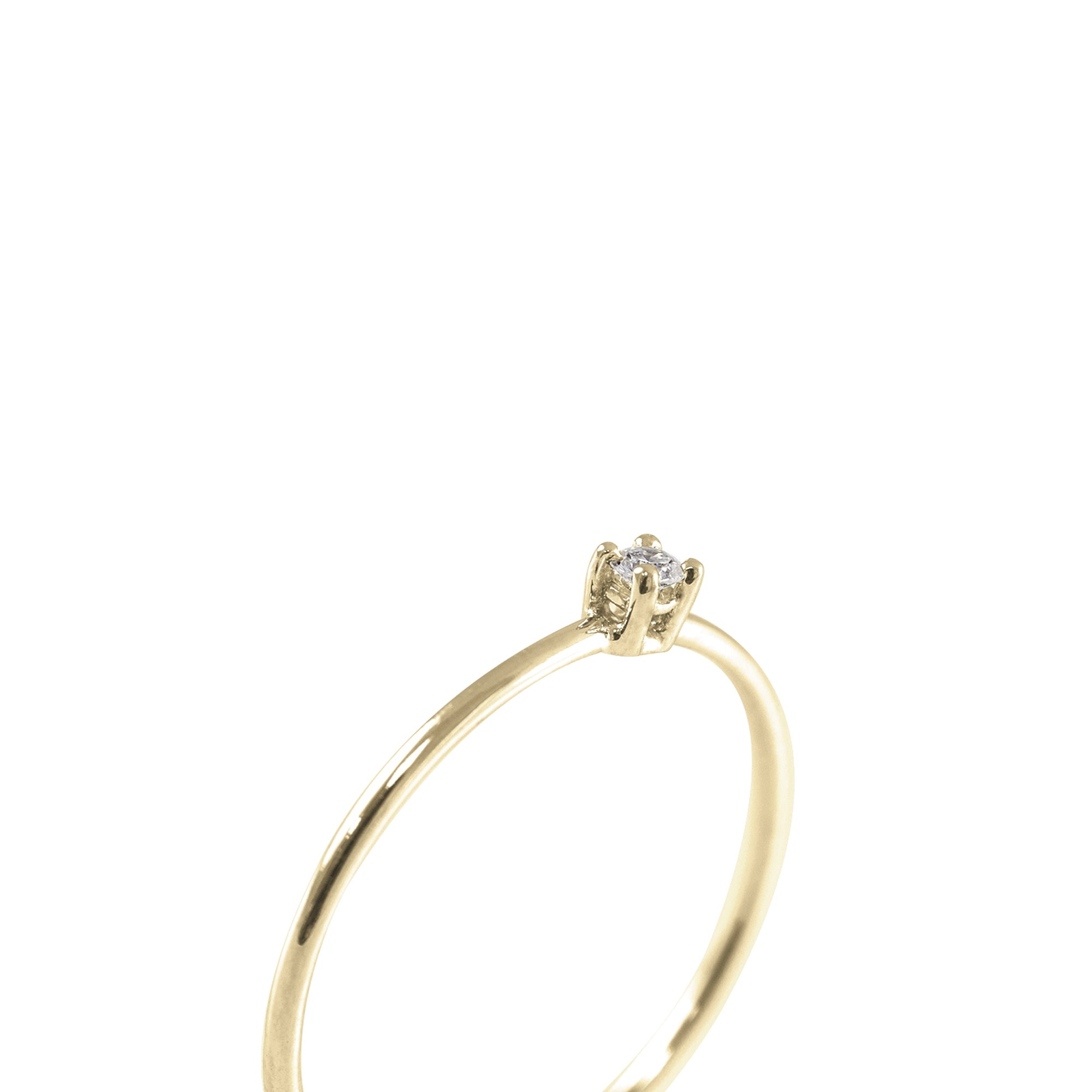 Solitario Diamante 0.035ct oro 18kt talla brillante. Montura 4 grapas.